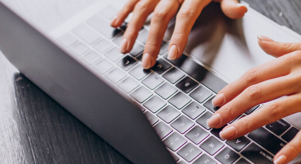 Person typing on the computer