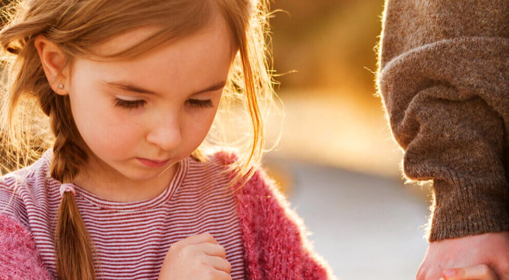 girl holding man's hand